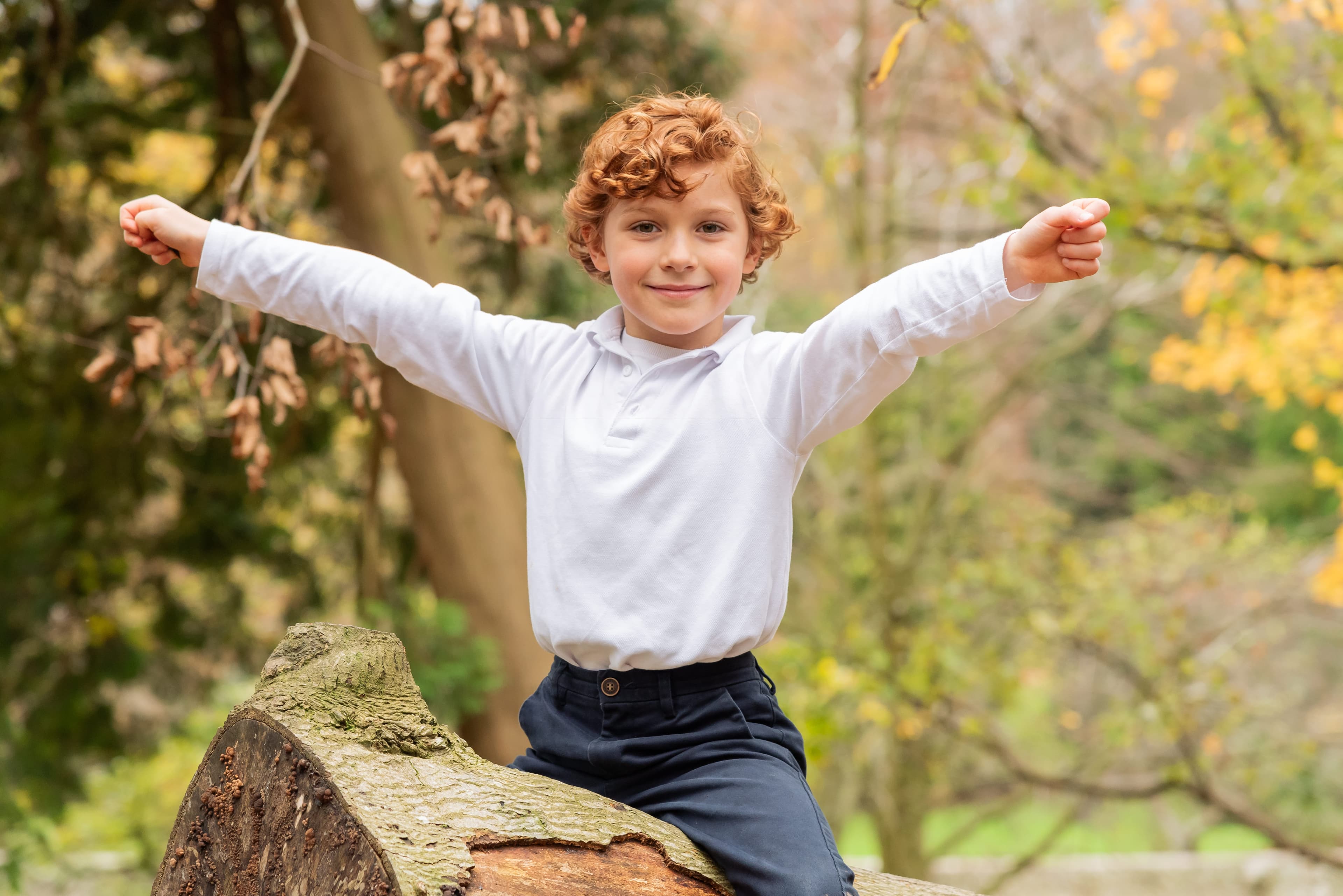 Public-facing version of the same outdoor school photo with the scene preserved and the pupil anonymised.