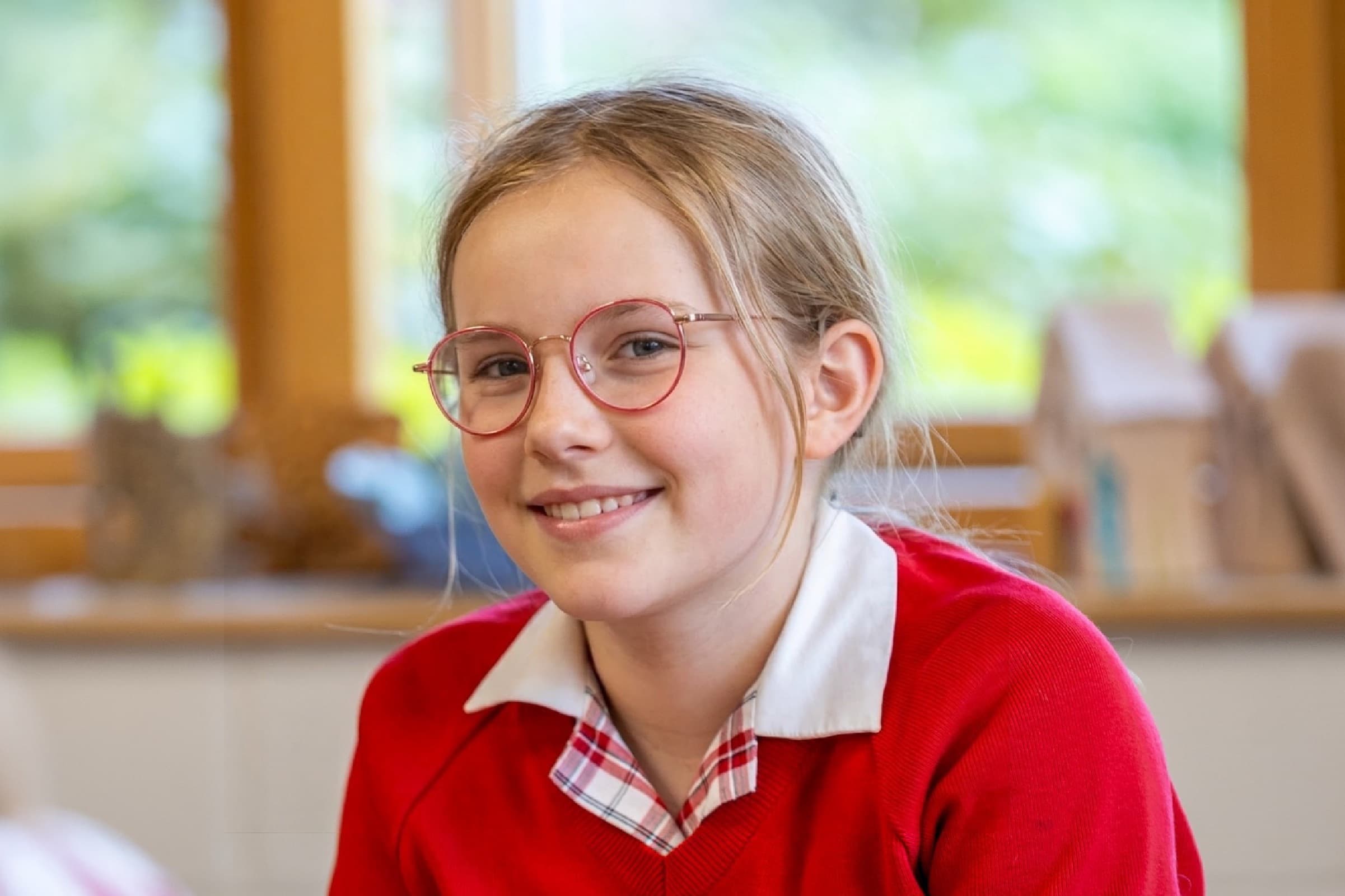 Public-facing version of the same classroom photo with the setting preserved and the pupil anonymised.